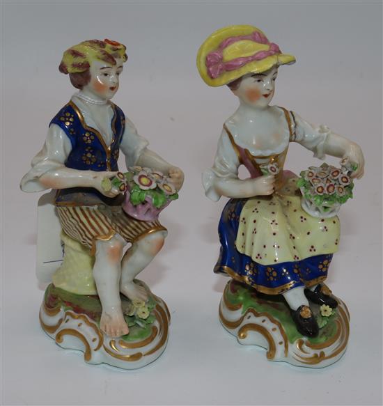 Pair of Derby porcelain figures in 18C costume holding flower baskets (faults)(-)